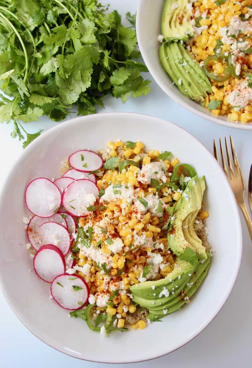 Bowl filled with corn, radishes and avocado