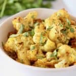 Indian cauliflower and roasted chickpeas in white bowl