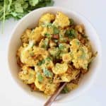 Indian Curry Cauliflower in bowl with roasted chickpeas