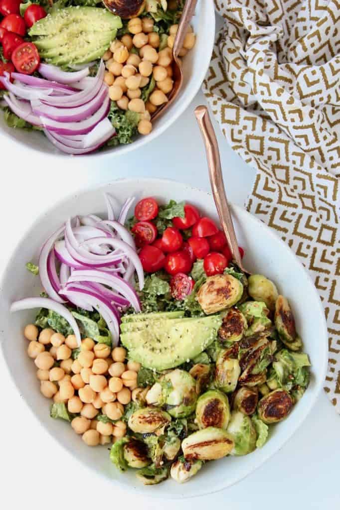 Vegan cobb salads in bowls with gold forks