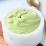 Image of avocado dressing in small bowl with text overlay