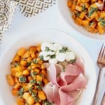 Image of roasted butternut squash topped with basil pesto in bowl with text overlay