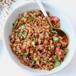 Overhead image of Mexican spiced cauliflower rice in bowl with spoon