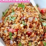 Mexican roasted cauliflower rice in bowl with spoon