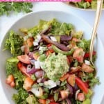 Overhead image of veggie fajita salad on bowl with text overlay