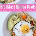 Sunny side up egg in bowl with quinoa, avocado and tomatoes