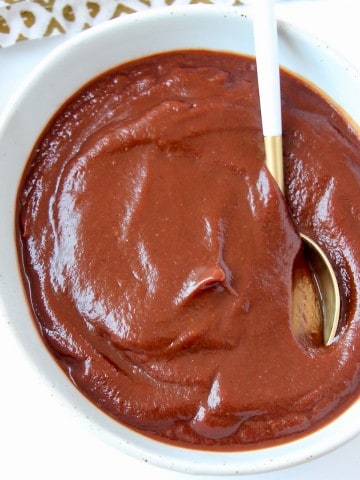 BBQ sauce in bowl with spoon