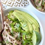 Overhead image of pulled pork in bowl with jalapenos and avocado