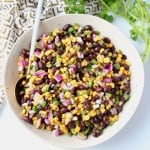 Black beans and corn in bowl with spoon