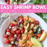Overhead image of cooked shrimp in bowl with tomato cucumber salad