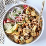 overhead image of cauliflower shawarma bowl with gold fork