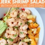 cooked shrimp salad in bowl with gold fork