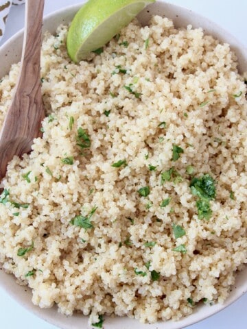 cooked quinoa in bowl with spoon