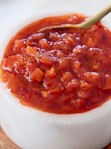 small white bowl of harissa sauce