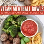 bowl filled with vegan meatballs, chickpea pasta, broccoli and marinara sauce