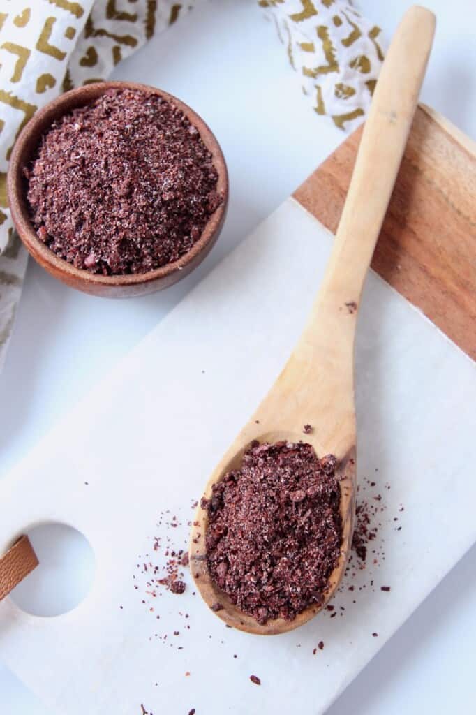 ground sumac spice in spoon and small bowl