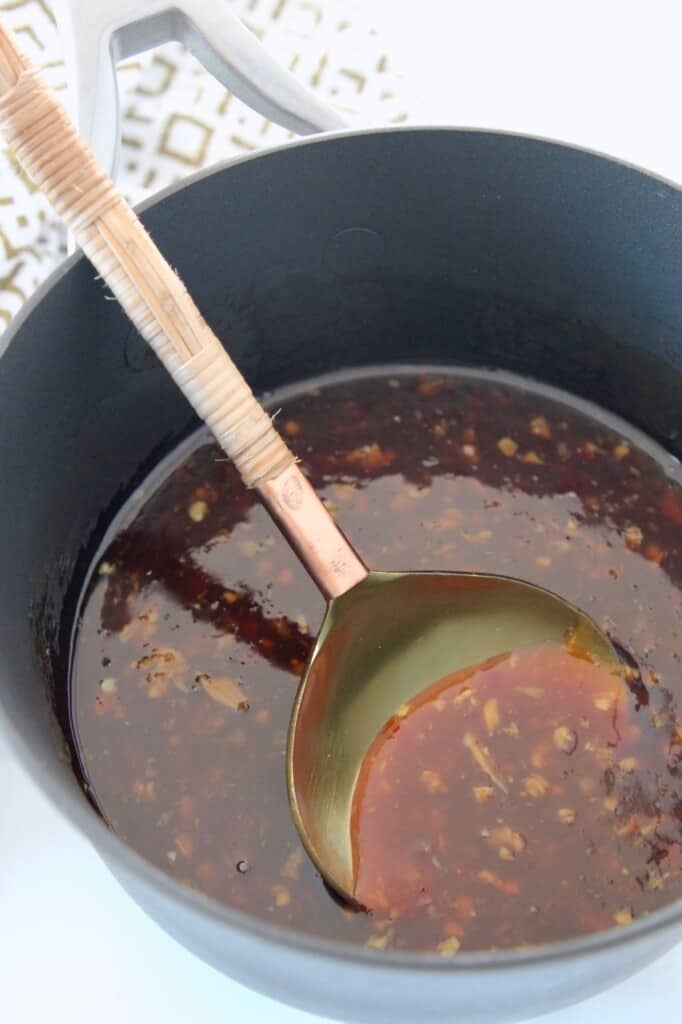 teriyaki sauce in saucepan with serving spoon