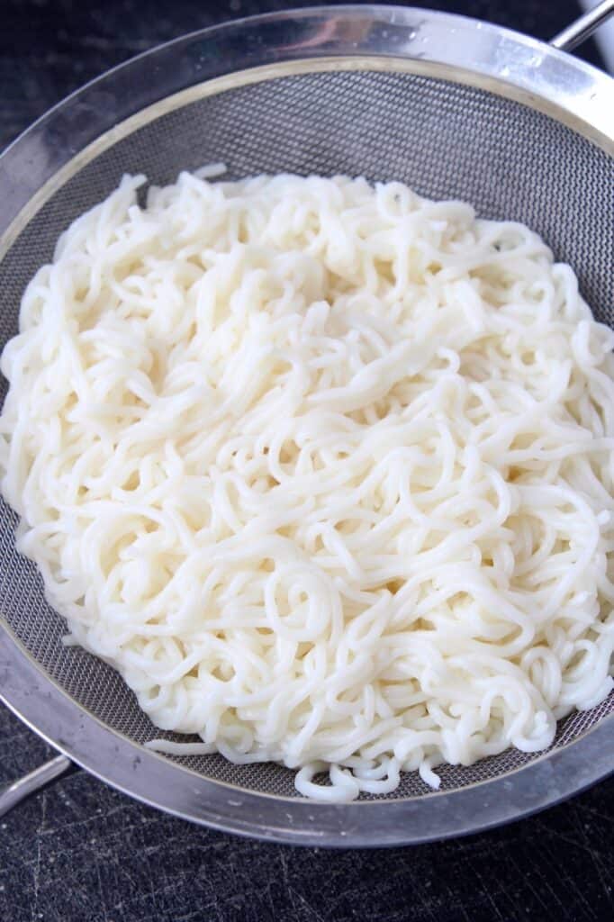 shirataki spaghetti noodles in fine mesh strainer