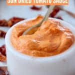 sun dried tomato sauce in white bowl with spoon