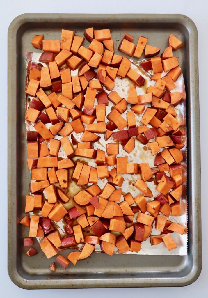 diced sweet potatoes on baking sheet