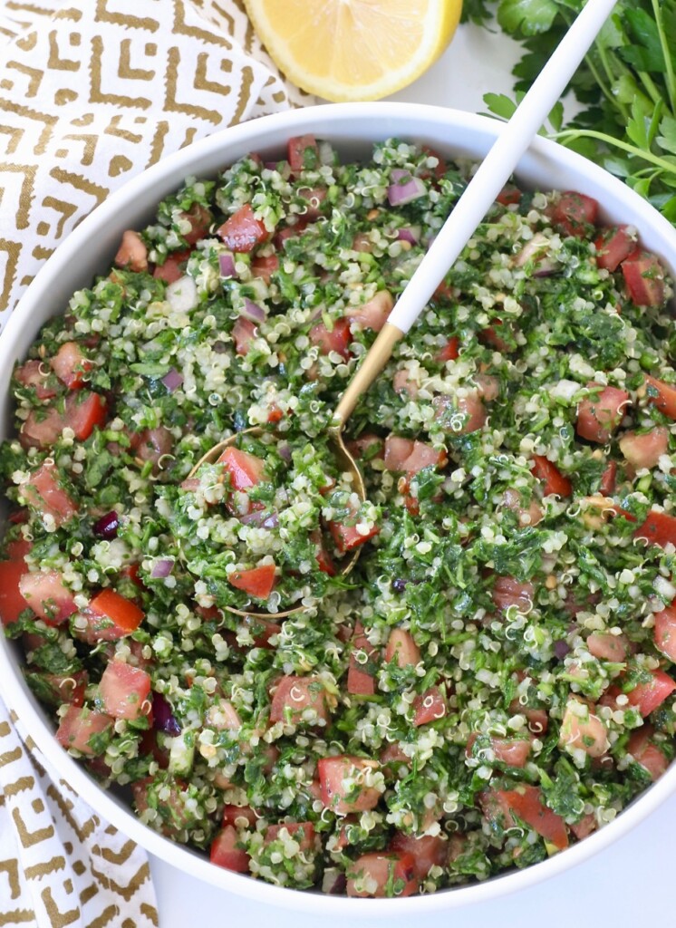 tabouli salad in bowl with spoon