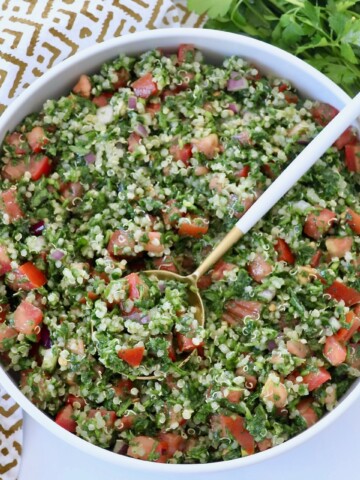 quinoa tabbouleh salad in bowl with spoon