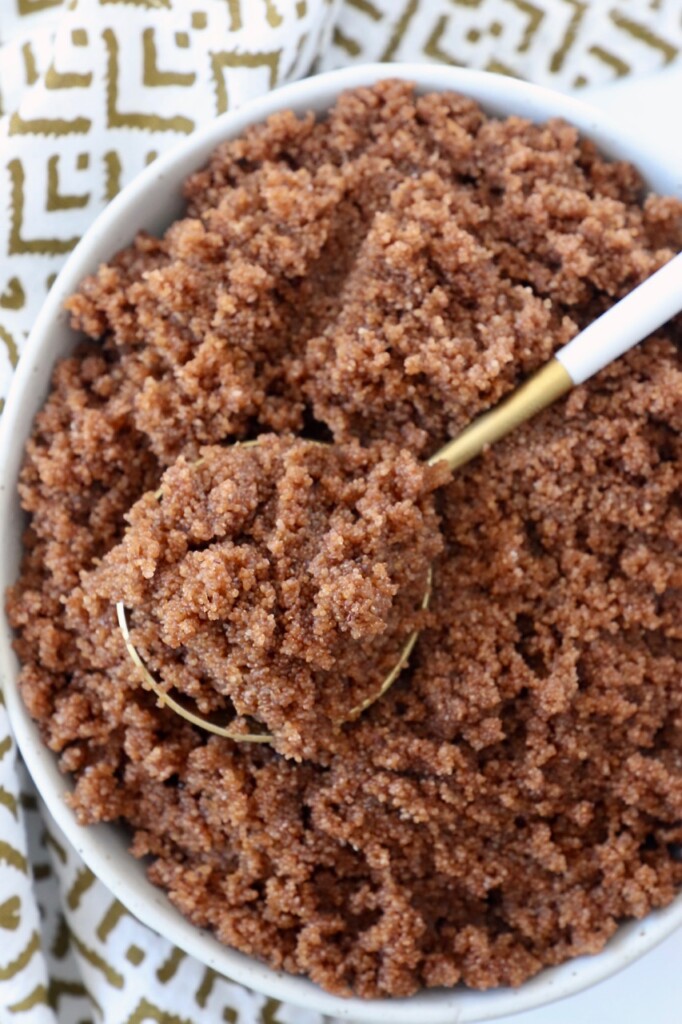 cooked teff in bowl with spoon