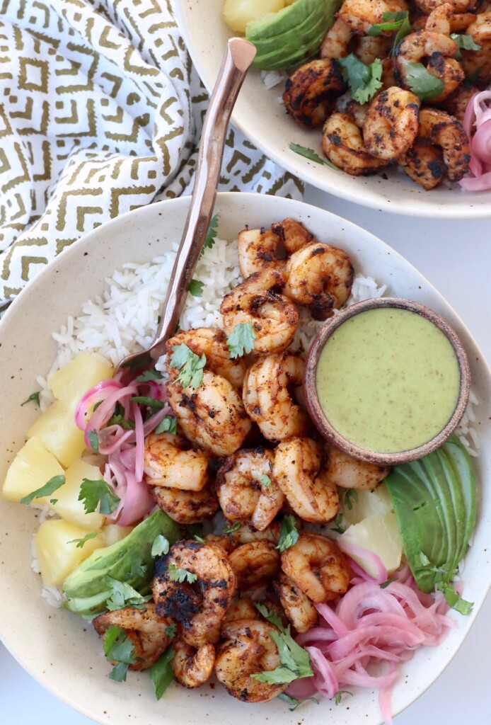 blackened shrimp in bowl with honey lime dressing and rice