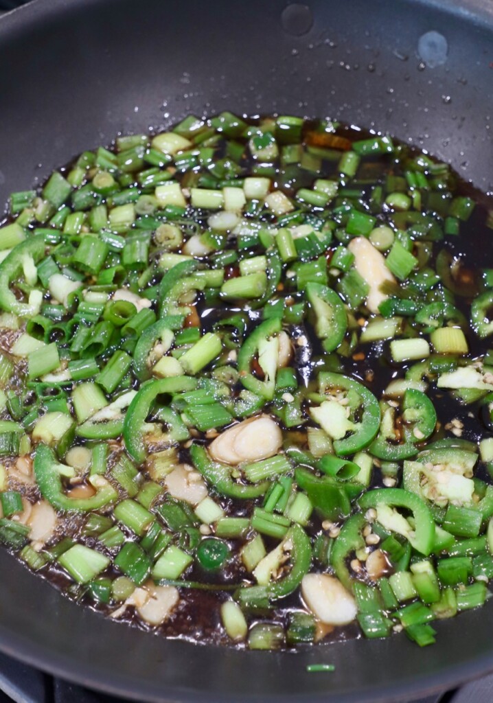 sliced vegetables in sauce in skillet