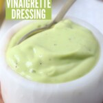 creamy avocado vinaigrette dressing in bowl with spoon
