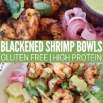 blackened cooked shrimp in bowl with honey lime dressing and pickled onions