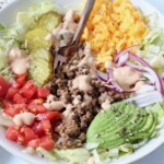 burger bowl with cooked ground beef, chopped veggies and cheese