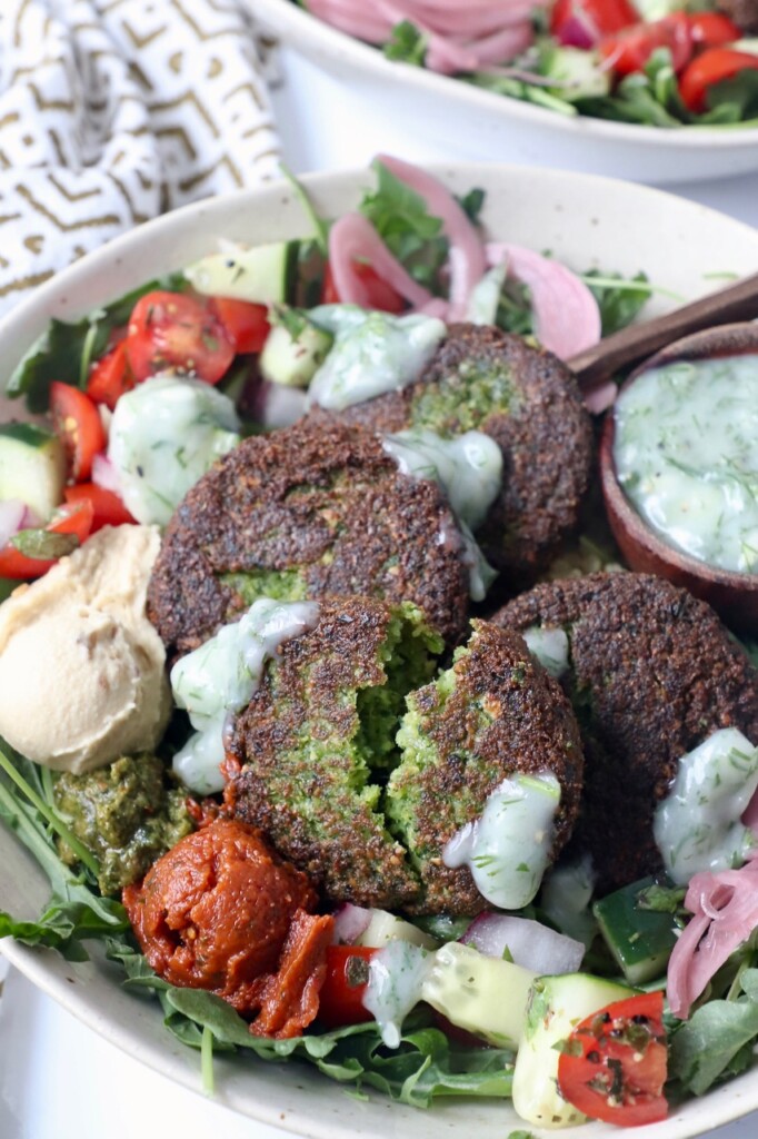 falafel in bowl with hummus and vegetables