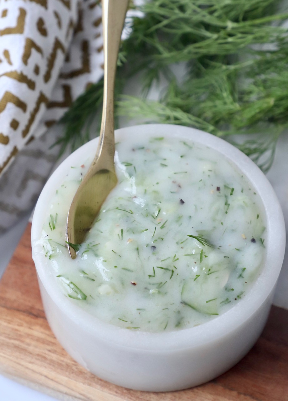 tzatziki sauce in bowl with spoon